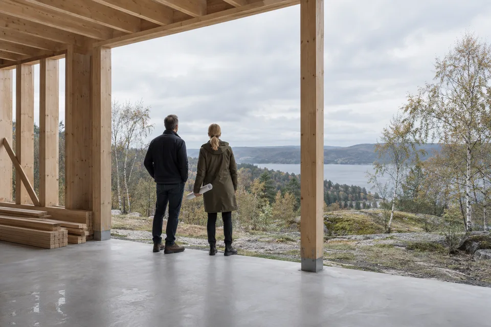 AI-generated scene of a client and architect considering a plot from an unfinished timber building